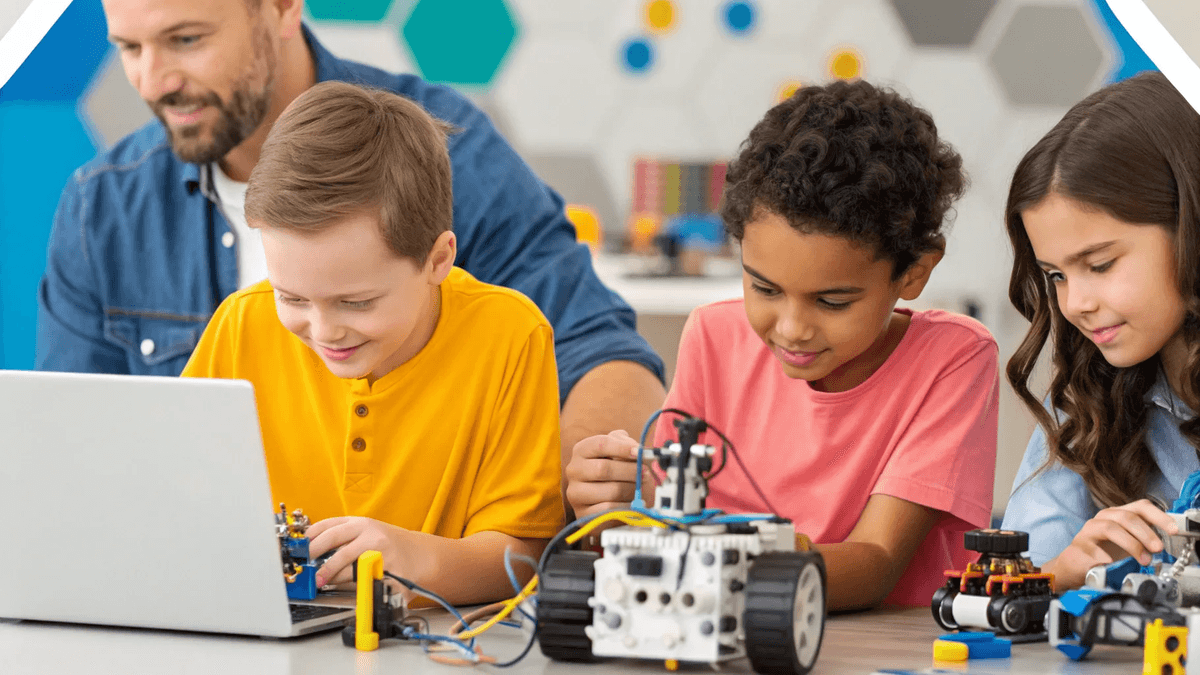 Kids and a mentor collaborating on a robotics kit in a classroom